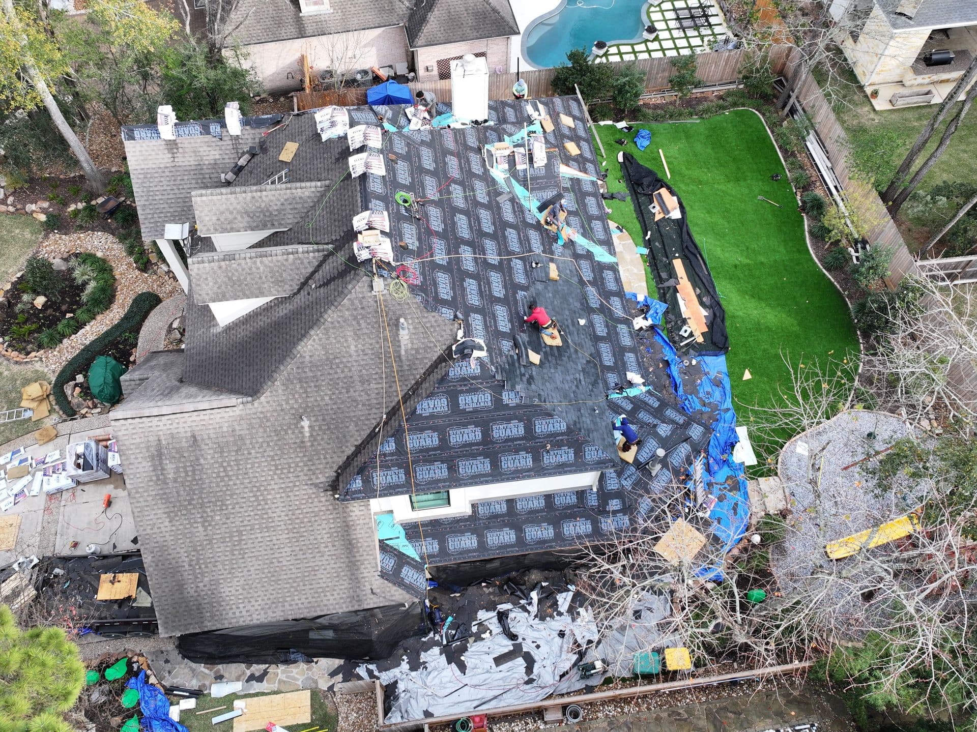 Aerial view of a full roof tear-off and replacement by True Line