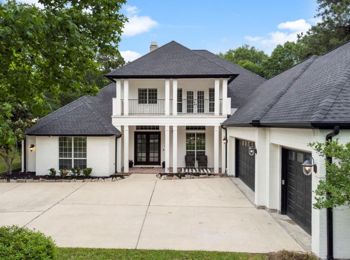 Completed shingle roof on a two-story home by True Line Roofing